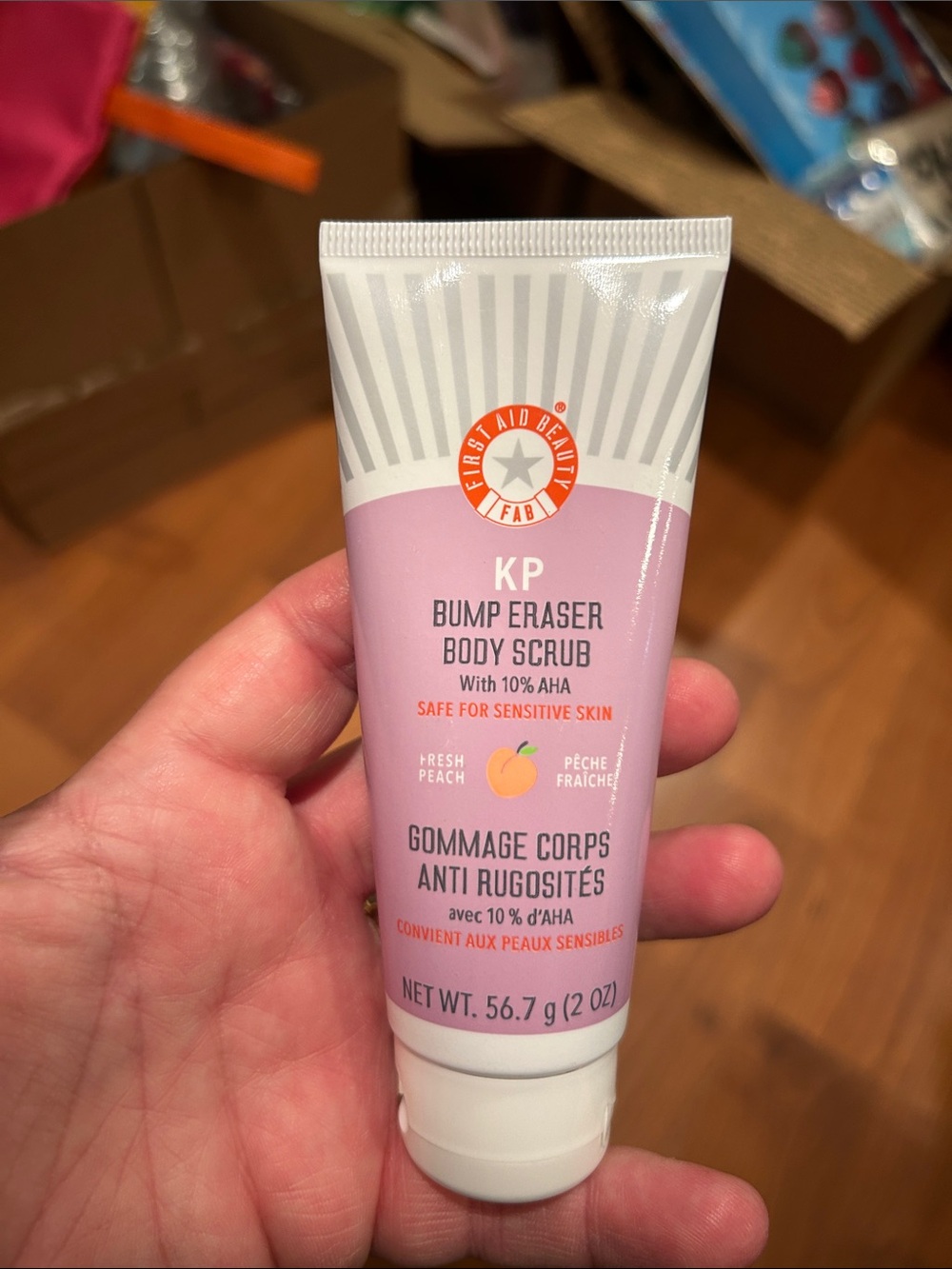 First Aid Beauty KP Bump Eraser Body Scrub - Light Peach & White Tube